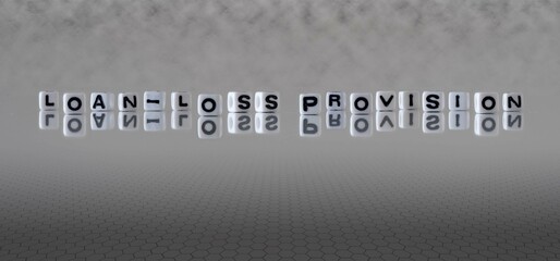 loan loss provision word or concept represented by black and white letter cubes on a grey horizon...
