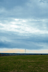 background landscape with big green field and blue sky and white clouds