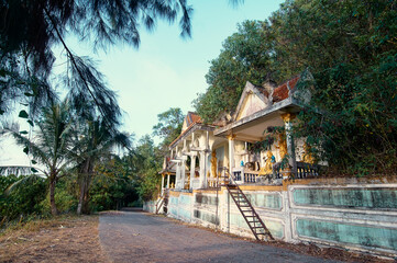 A bit abandoned buddhist temple near a road. Phuket, Thailand.