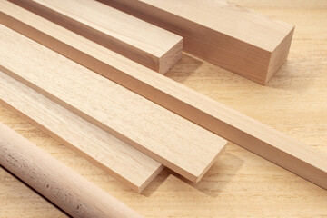 Group of assorted wood material like planks, squares, sheets. Timber for carpentry