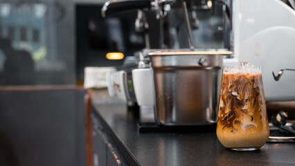 glass of coffee with milk on a white canvas