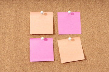 Group of four Blank note on a cork board for adding text and push pin. Mock up