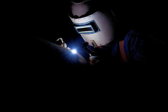 the close up of a welding worker working