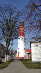 Operating red - white lighthouse in the city of Baltiysk, Kaliningrad region.