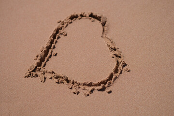 Seashore with sand and hearts. Ocean coast and beach coast