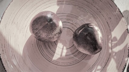Two ripe nectarines on plate. Art foto