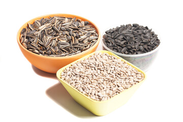 Sunflower seeds in cup isolate on a white background