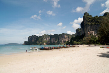 Landscape Traveller on Railay Phranang Beach  white sand and blue sea with limestone in Railay Ao nang Krabi Thailand - sunny day summer    