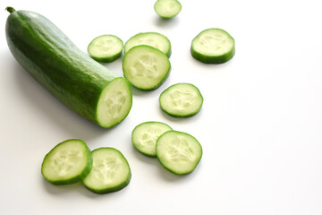 Cucumber on white table.  Healthy and dietary food concept.  Copy space is on the right side. 