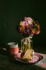 still life with flowers and pie