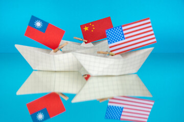 paper ship with national flag of Taiwan and USA , concept of military alliance security,  independence conflict tensions, shipment or free trade agreement