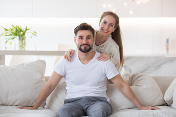 Couple relaxing in living room