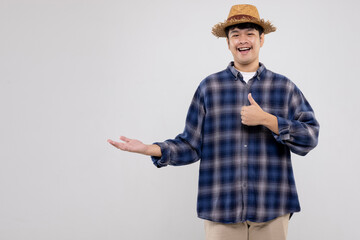Portrait of young Asian man farmer thumbs up hand signal. Smart farmer on isolated white background.