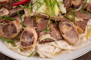 Closeup on portion of kazakh national dish beshbarmak