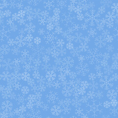 Seamless winter background consisting of snowflakes of different shapes. White snowflakes and blue background. Christmas and new year symbol and mood.