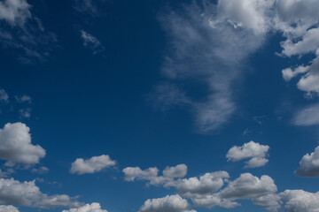 Blue sky background with white clouds. 