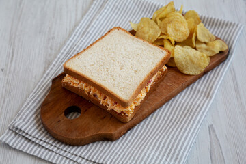 Homemade Pimento Cheese Sandwich with Chips, side view.