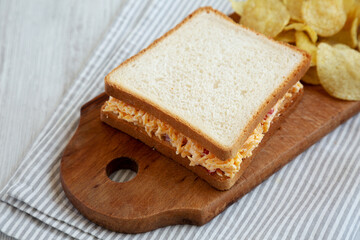 Homemade Pimento Cheese Sandwich with Chips, side view.