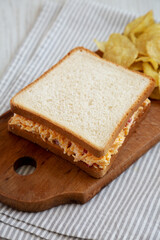 Homemade Pimento Cheese Sandwich with Chips, side view.