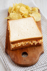Homemade Pimento Cheese Sandwich with Chips, low angle view.
