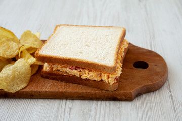 Homemade Pimento Cheese Sandwich with Chips, side view. Close-up.