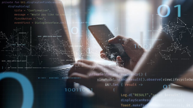 Digital software technology, mobile app development concept. Computer programmer, software developer coding on laptop computer with javascript and binary code