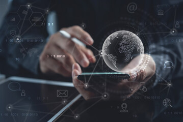 Global internet network connection technology, IoT, Internet of Things concept. Business man using mobile phone with global network and technology icons virtual display