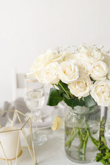 The wedding decor. Wedding teble decoration with white roses, closeup