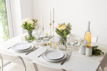 The wedding decor. Wedding teble decoration with white roses