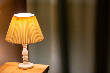Lamp. Night light by the bedside table with warm light. Intimate setting. Lamp for reading a book...