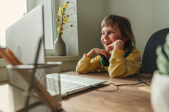 Little girl using technology at home indoor