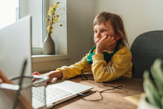 Little girl using technology at home indoor