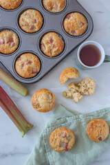 home made almond rhubarb muffins on a table