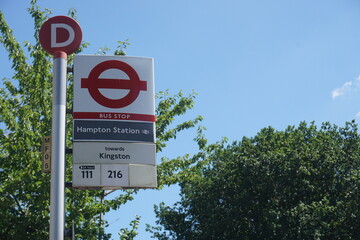 Bus stop sign in hampton, london. 