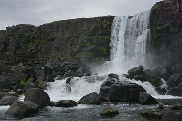 Waterfall crashing down in Iceland. 