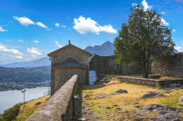 View of the castle of the Unnamed Castel, Rocca dell'innominato, among wonderful landscapes on Lake Como, Lecco, Italy - obrazy, fototapety, plakaty