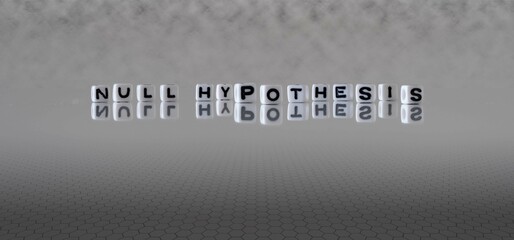 null hypothesis word or concept represented by black and white letter cubes on a grey horizon background stretching to infinity - obrazy, fototapety, plakaty