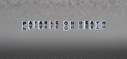 payable on death word or concept represented by black and white letter cubes on a grey horizon background stretching to infinity