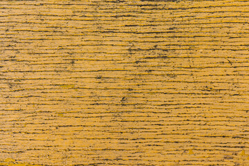 Close up of cracked wooden yellow texture of vintage painted board.