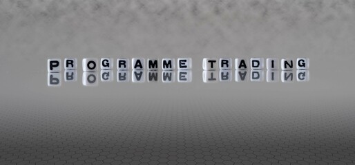 programme trading word or concept represented by black and white letter cubes on a grey horizon...