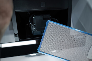 Aspirator, the filter of the extractor hood in a modern kitchen, healthy ventilation, odorless kitchen