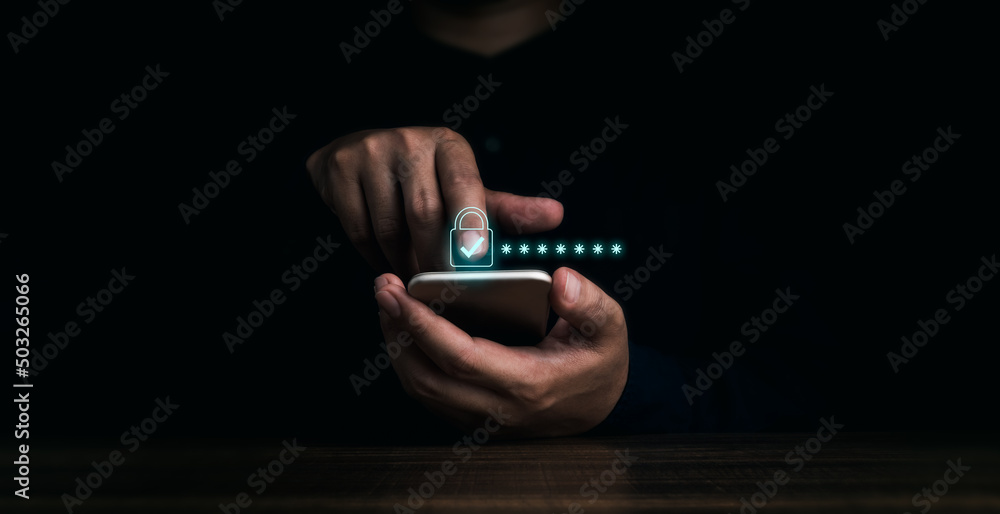 Poster lock icons and password hidden behind asterisks appear while man's finger touching on mobile phone o