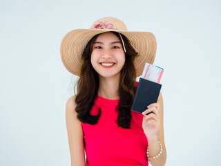 Happy smile of pretty cute young Asian woman portrait wearing red sleeveless and beach hat holding passport and flight ticket isolated on white background. Summer holiday travel and vacation concept.