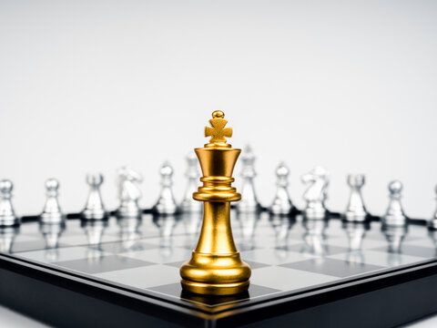 Premium Photo  The silver horse, knight chess piece standing with falling  golden queen, rook, bishop, pawn pieces on chessboard on dark, vertical.  leadership, winner, competition, and business strategy concept.