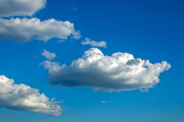 Naklejka na ściany i meble Clouds against the blue sky, Cumulus, Stratocumulus