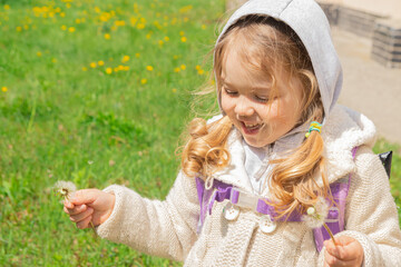 green, field, dandelion, cute, child, attractive, baby, background, beautiful, bloom, bright, carefree, caucasian, childhood, face, family, flower, fun, girl, grass, hand, happy, joy, kid, lifestyle, 