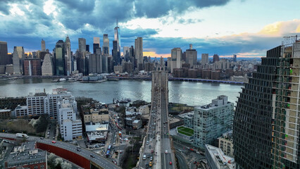 Manhattan skyline view from Brooklyn with Bridge at sunset New York City NYC