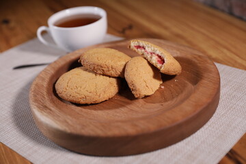 berry tea and a decorative wooden plate is very beautiful for vegetables and cookies, sweets and desserts as an element of decor for interior design