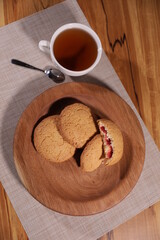 berry tea and a decorative wooden plate is very beautiful for vegetables and cookies, sweets and desserts as an element of decor for interior design