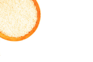 Long Basmati rice in wooden bamboo bowl isolated on white background with copy space. Macro. Flat lay. Vegetarian food concept